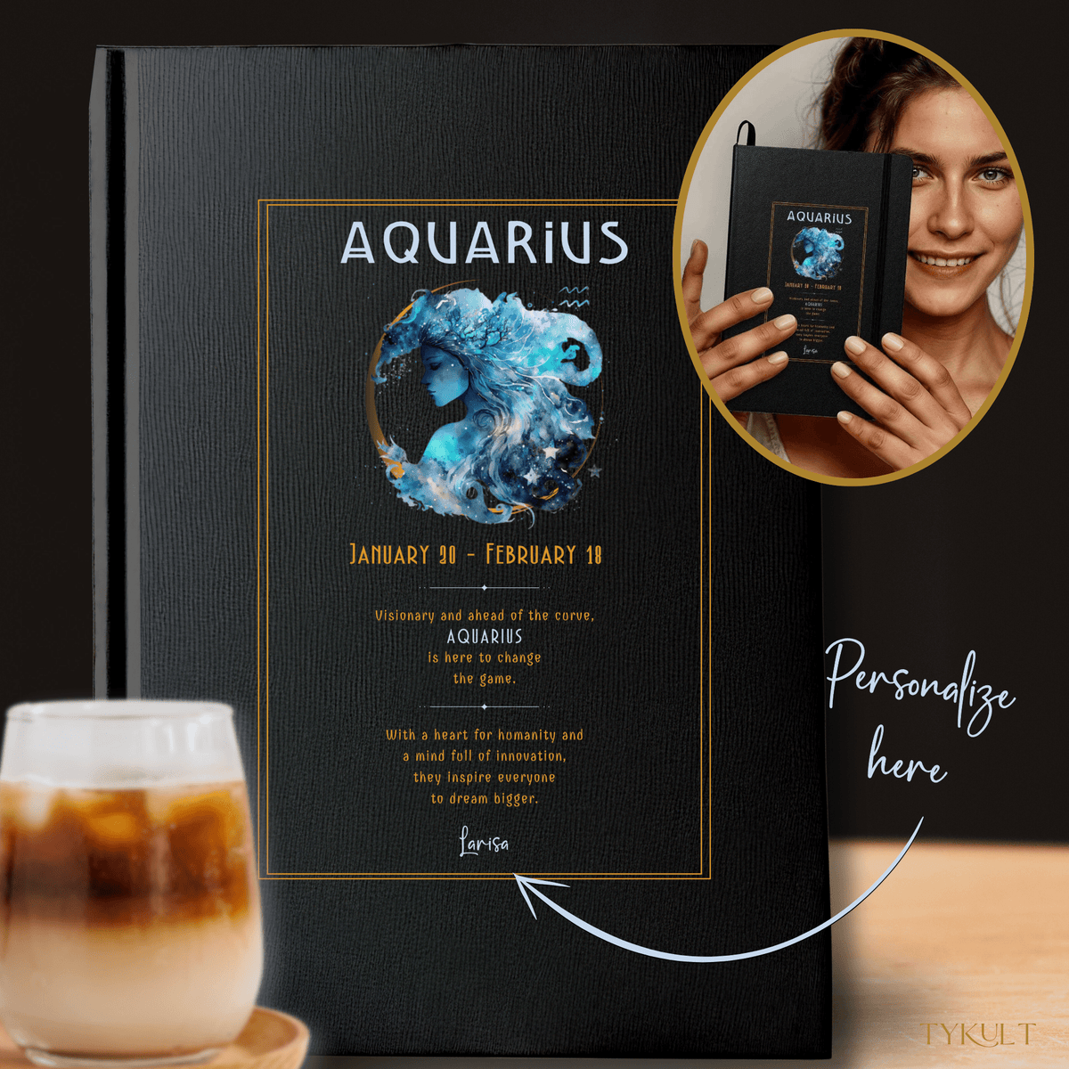 Aquarius-themed black journal with celestial artwork, featuring a personalized name option and inspirational zodiac description, displayed alongside a coffee drink